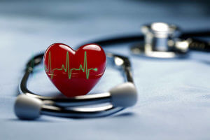 Heart and a stethoscope with heartbeat (pulse) symbol in Light blue background