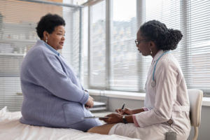 Endocrinologist Listening to her Patient talk about diabetes symptoms