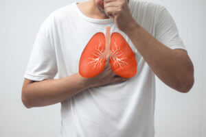 An illustration of a faceless sick man coughing due to a lung infection.