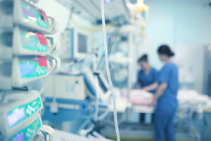 A critical care team of working nurses in the CCU for a patient with chronic critical illness.