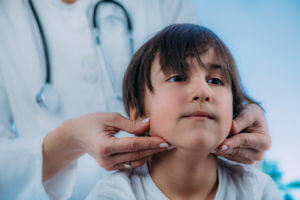 A pediatric endocrinologist is examining a preschool-aged boy.